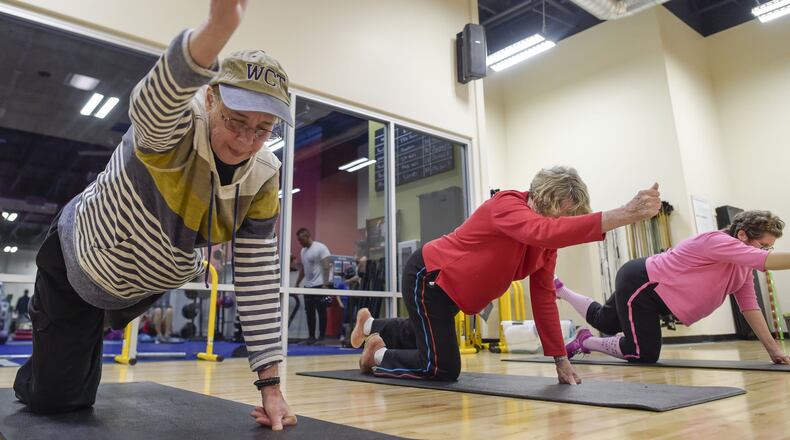 In this file photo in February, cancer survivors from left, Dana Hadley, Beverly Tobey and Dina Moerschbacher stay in shape during recovery with a fitness program run by cancer exercise specialist Jeff Rheault and instructor Jessica Tax with the nonprofit Triumph Foundation at California Family Fitness in Sacramento, Calif. MANNY CRISOSTOMO/THE SACRAMENTO BEE/TNS