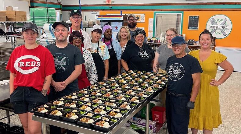 Nick Testa (back) is shown with coworkers and prepped food at Miami Valley Meals, which provides hardy meals to those in need in the Dayton area. "We make meals from recovered or rescued food. We make meals from recovered or rescued food and distribute them to different organizations like East End, different churches. We have 50 active partners and make around 4,500 meals a week," says Testa.