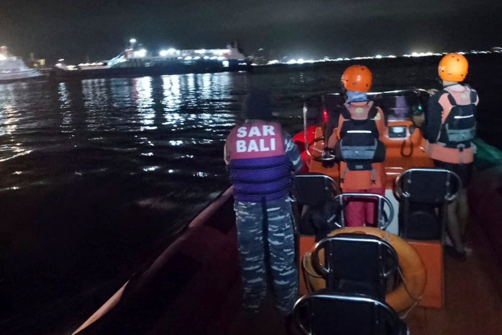 In this photo released by the Indonesian National Search and Rescue Agency (BASARNAS) rescuers search for victims after a ferry enroute for the resort island of Bali sank off Ketapang, East Java, Indonesia, early Thursday, July 3, 2025. (BASARNAS via AP)