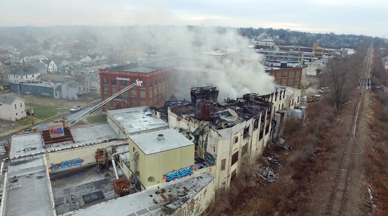The former Hewitt Soap Factory burned overnight on Thursday. The factory is located on Linden Ave. in east Dayton. TY GREENLEES / STAFF