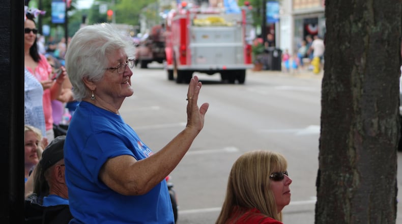 Betty Whitaker, 80, watches the parade at the opening day of Miamisburg’s bicentenial celebration, along with her daughter and grandchildren. CORNELIUS FROLIK / STAFF