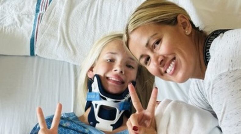 Valley View teen Olivia Kozuszek with her mom, Heidi, at Dayton Children's Hospital after Olivia suffered a traumatic injury from a fall in June 2023. COURTESY OF DAYTON CHILDREN'S