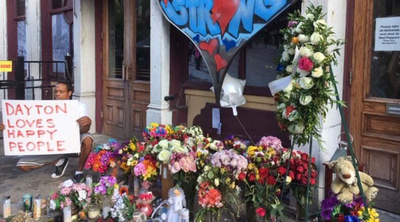 A memorial near Ned Peppers bar in the Oregon District, photographed Aug. 7. THOMAS GNAU/STAFF