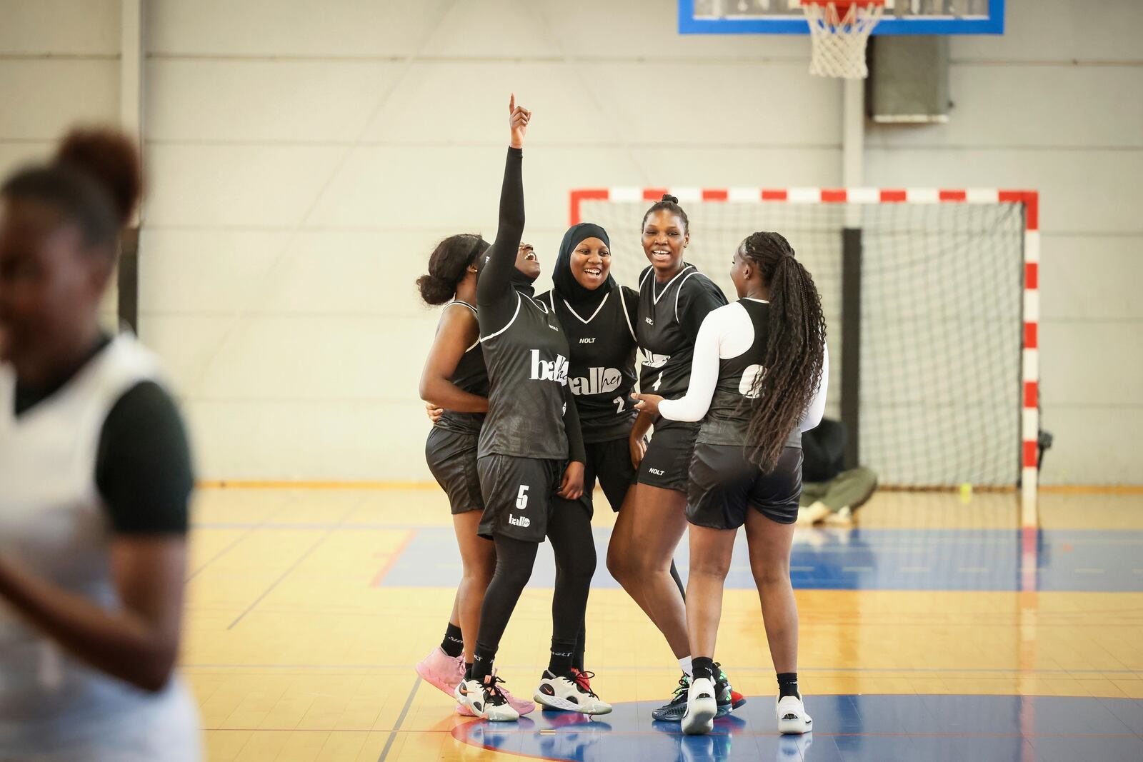 Players react during a basketball game in Aubervilliers near Paris, Sunday, April 27, 2025. (AP Photo/Thomas Padilla)