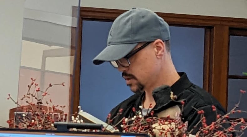 A bank robber handed a note demanding money to tellers Friday, Dec. 2, 2022, at the LCNB branch in Lewisburg in Preble County. CONTRIBUTED