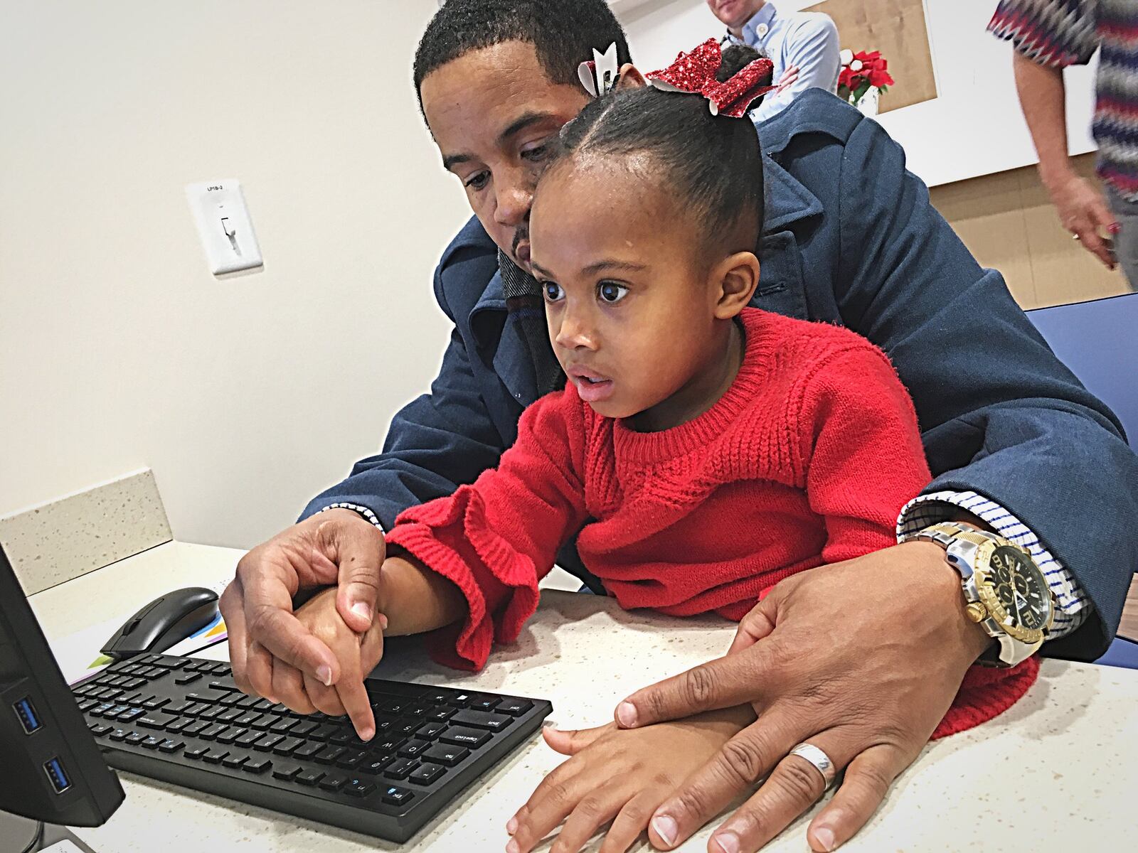 Charles Harden and daughter Kayla Harden on Wednesday Dec 18, sign up for the Imagination Library program. Marshall Gorby/Staff Photo