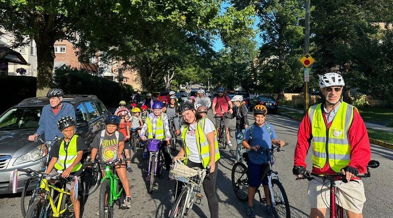 Children ride their bicycles to school during a parent-led bike ride titled "Bike Bus" Sept. 15, 2025, in Montclair, N.J. (Andrew Hawkins/Montclair Bike Bus via AP)