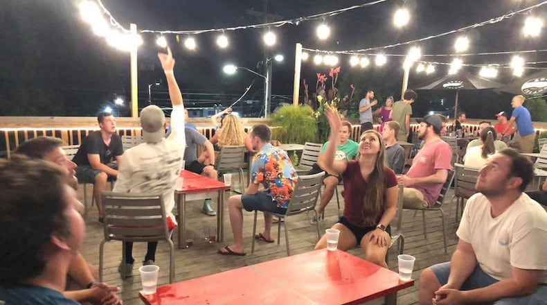 Dayton Sportcial players play a game of Beer Die. CONTRIBUTED
