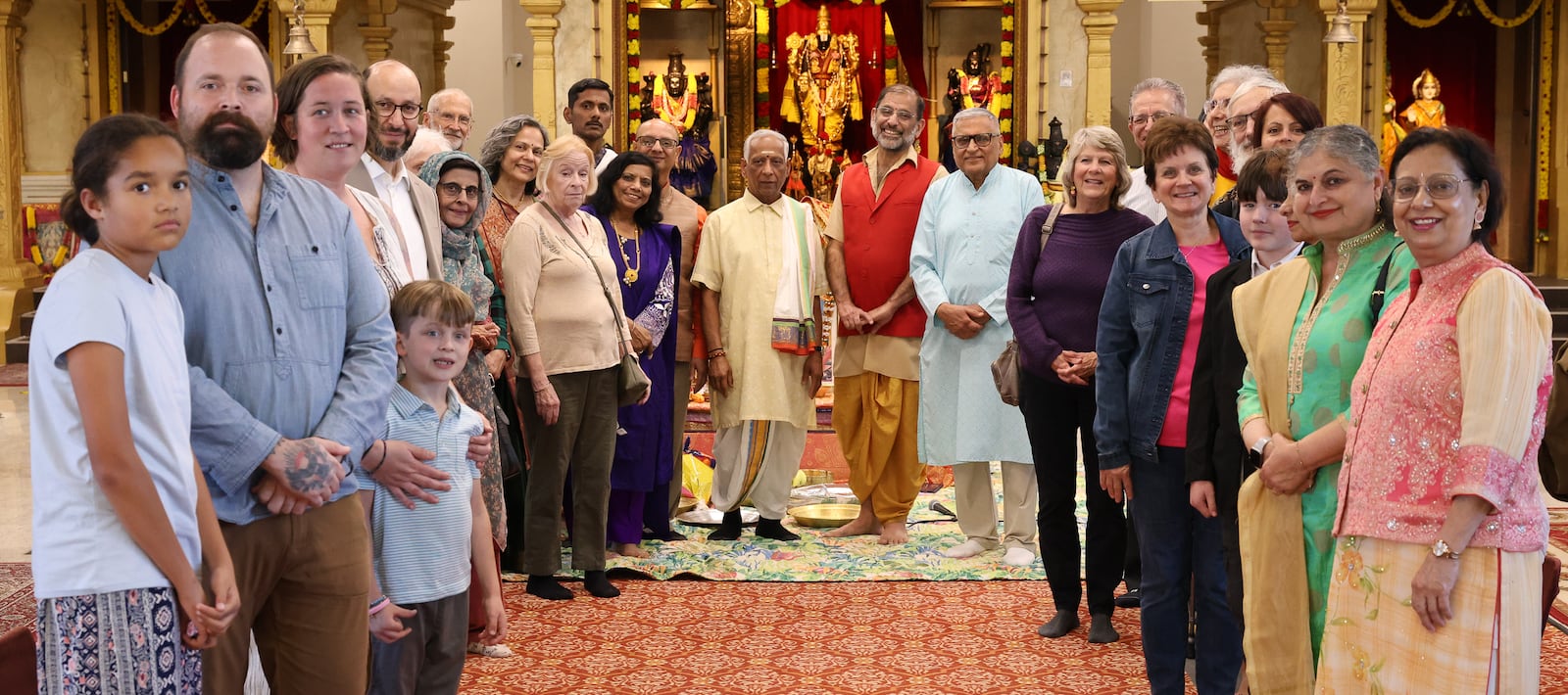 Members of Hindu Temple of Dayton and members of an interfaith group pose for a photo before service celebrating Diwali on Tuesday, Oct. 20 in Beavercreek. BRYANT BILLING/STAFF
