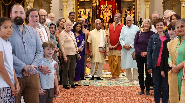 Members of Hindu Temple of Dayton and members of an interfaith group pose for a photo before service celebrating Diwali on Tuesday, Oct. 20 in Beavercreek. BRYANT BILLING/STAFF