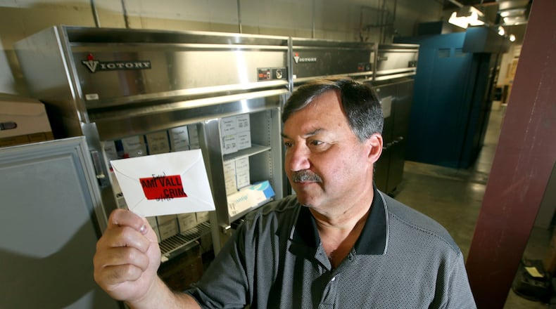 Ken Betz, who retired as director of the Miami Valley Regional Crime Laboratory and the Montgomery County Coroner’s Office this month, has been a part of some of the biggest criminal cases and area disasters during his 46-year career. LISA POWELL / STAFF