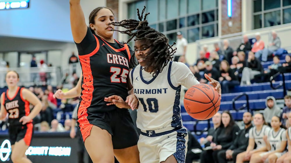 Fairmont High School's Janiyah Hargrave drives to the hoop against Beavercreek's Cameron King during their game last season at Fairborn High School. MICHAEL COOPER/CONTRIBUTED