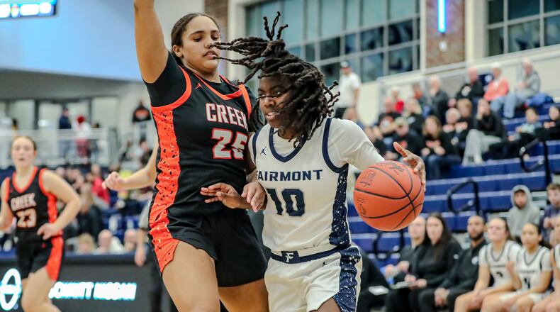 Fairmont High School freshman Janiyah Hargrave drives to the hoop against Beavercreek freshman Cameron King during their game on Tuesday night at Fairborn High School. MICHAEL COOPER/CONTRIBUTED