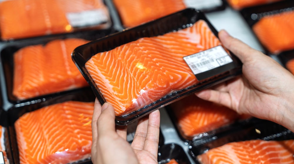 Pictured is packs of fresh salmon fillet from a display shelf in a grocery store. ISTOCK