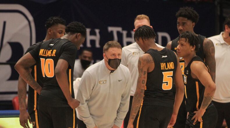 Virginia Commonwealth's Mike Rhoades talks his team during a game against Dayton on Tuesday, Feb. 9, 2021, at UD Arena. David Jablonski/Staff