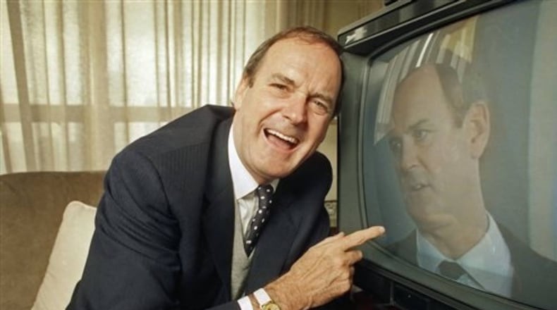 John Cleese immortalized "silly walks" whie part of the Monty Python comedy troupe. A Michigan family borrowed his concept to bring smiles to their neighbors' faces. (Mark Elias/Associated Press)