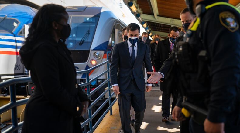 Transportation Secretary Pete Buttigieg walks from a train platform after visiting with Amtrak workers at Union Station in Washington, Friday, Feb. 5, 2021. (AP Photo/Carolyn Kaster)
