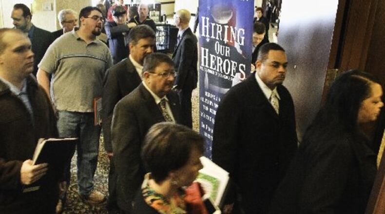 The region is attempting to attract more veterans to come here or stay here after they finish their service careers. Here attendees gather at one of the numerous job fairs in the region aimed at veterans. CHRIS STEWART / STAFF