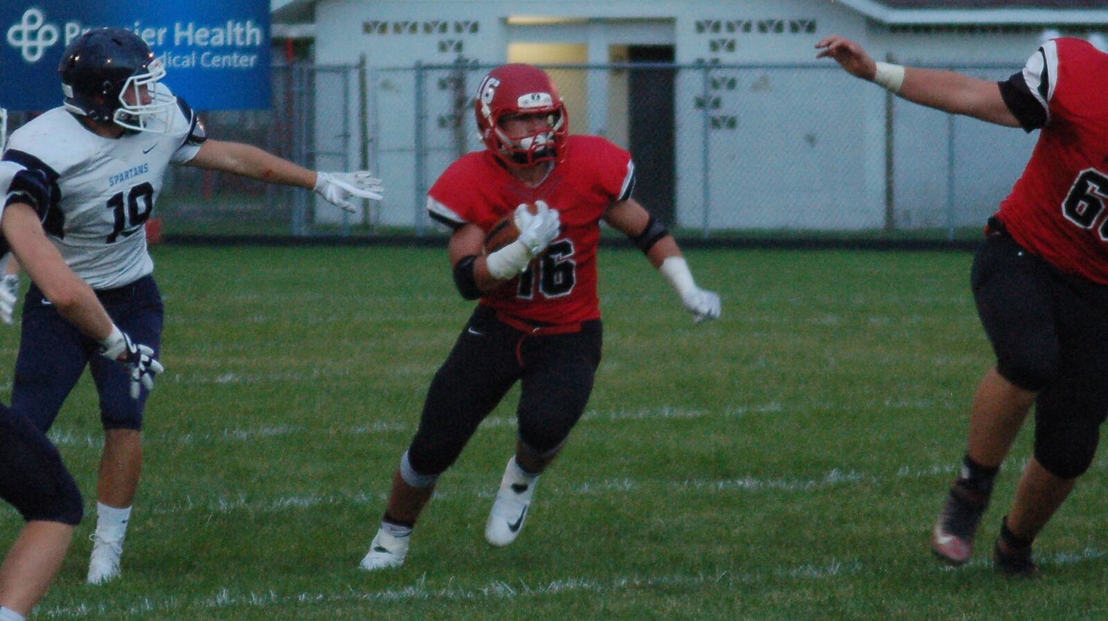 Madison’s Tyler Baumgartner (16) finds a hole in the Valley View defense during Friday night’s game at Brandenburg Field in Madison Twp. CONTRIBUTED PHOTO BY JOHN CUMMINGS