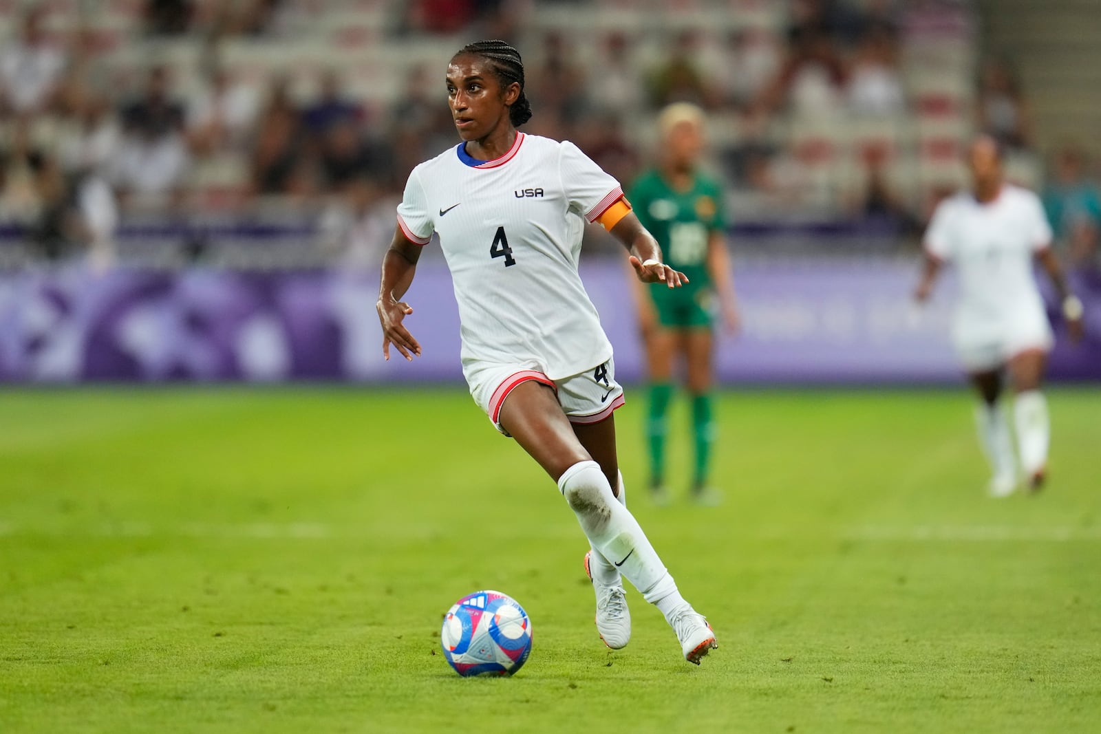 FILE - United States' Naomi Girma controls the ball during a women's group B match between the United States and Zambia at Nice Stadium at the 2024 Summer Olympics, Thursday, July 25, 2024, in Nice, France. (AP Photo/Julio Cortez, File)