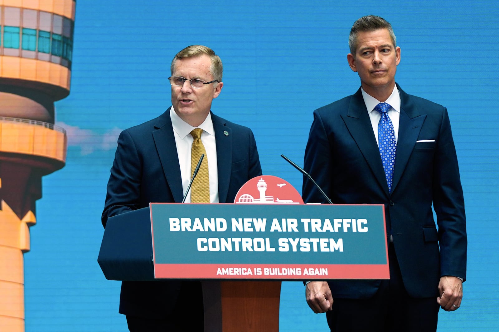 Chris Rocheleau, acting administrator of the Federal Aviation Administration, left, and Transportation Secretary Sean Duffy, right, speak about a new air traffic control infrastructure plan, Thursday, May 8, 2025, in Washington. (AP Photo/Julia Demaree Nikhinson)