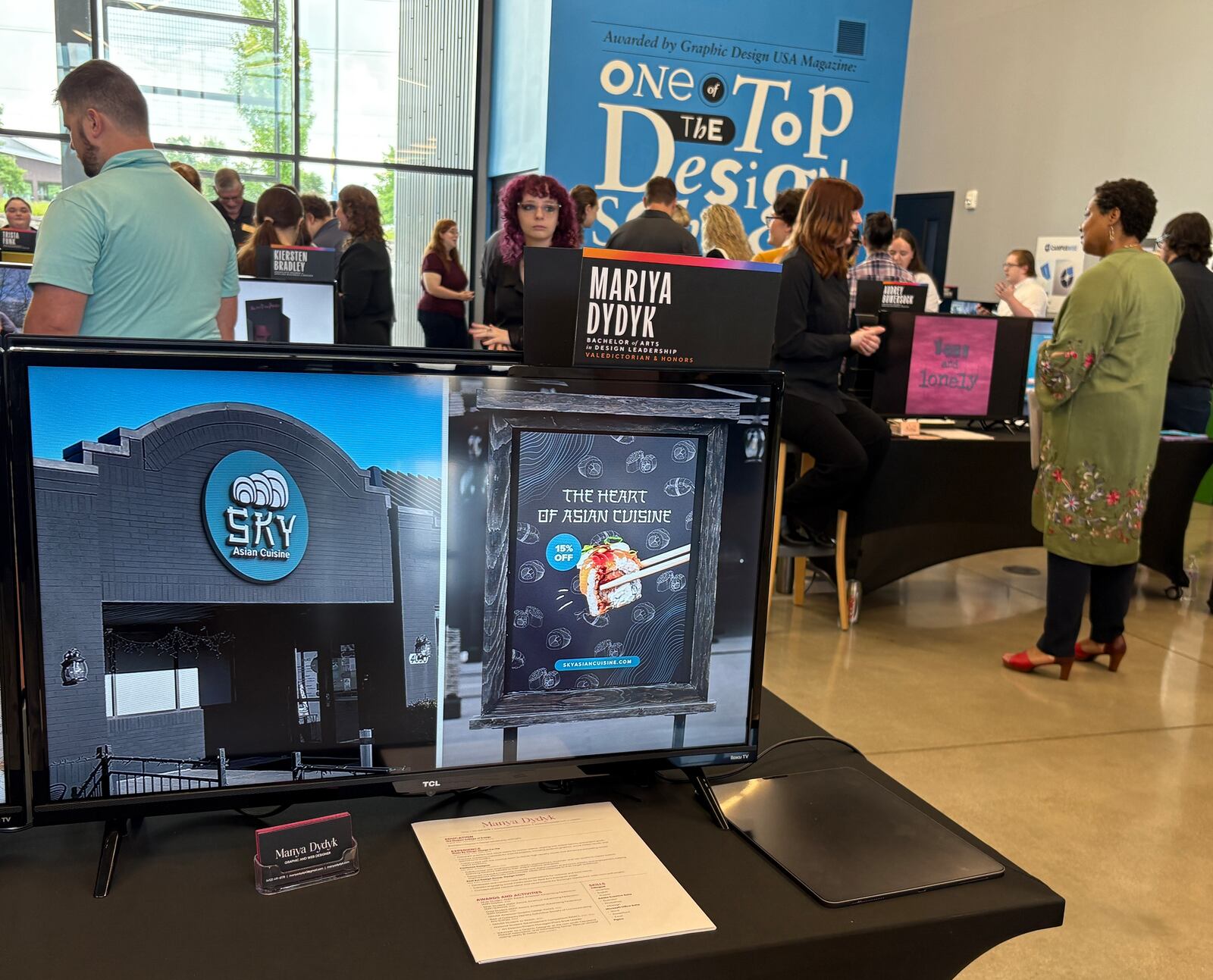 Mariya Dydyk, a 2025 graduate of The Modern College of Design in Kettering, shared her branding for Kettering restaurant Sky Asian Cuisine in her digital portfolio during the college's annual "Reveal" event Friday, June 6, 2025. JEN BALDUF/STAFF