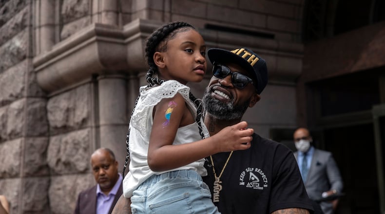 FILE -- Former professional basketball player Stephen Jackson holds Gianna Floyd, 6, daughter of George Floyd, at a news conference in Minneapolis on Tuesday, June 2, 2020. Those who knew Jackson during his 14-year NBA career are not surprised at how he has worked tirelessly as an activist in support of his friend George Floyd.