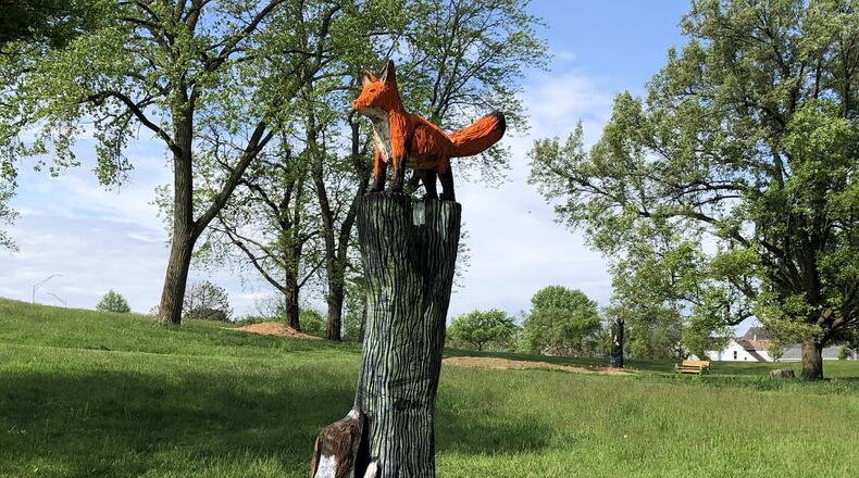 A dog park and chainsaw-carved sculptures by artist Patrick Allred of Economy, Ind., are among the recent updates at Highland Park, located at the corner of Steve Whalen Boulevard and Wyoming Avenue. CONTRIBUTED