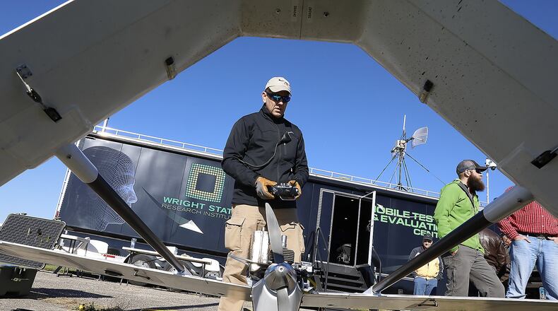 Dave Malek performs a safety check on a UAV before it takes off for one of the Air Force Research Labratory’s test flights at Springfield Beckley Municipal Airport Thursday. Bill Lackey/Staff