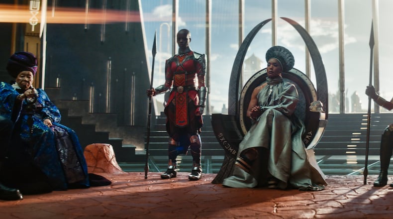 This image released by Marvel Studios shows, from left,  Dorothy Steel as Merchant Tribe Elder, Florence Kasumba as Ayo, Angela Bassett as Ramonda, and Danai Gurira as Okoye in a scene from "Black Panther: Wakanda Forever." (Marvel Studios via AP)