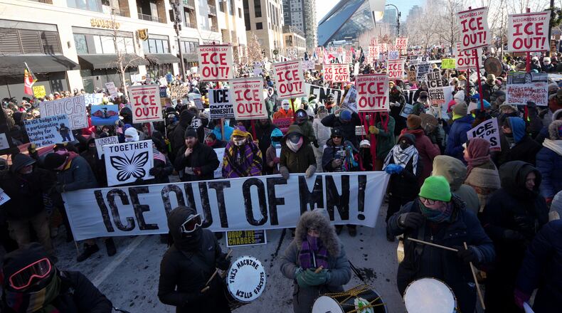 People protest against Federal immigration agents on Friday, Jan. 23, 2026, in Minneapolis. (AP Photo/Angelina Katsanis)