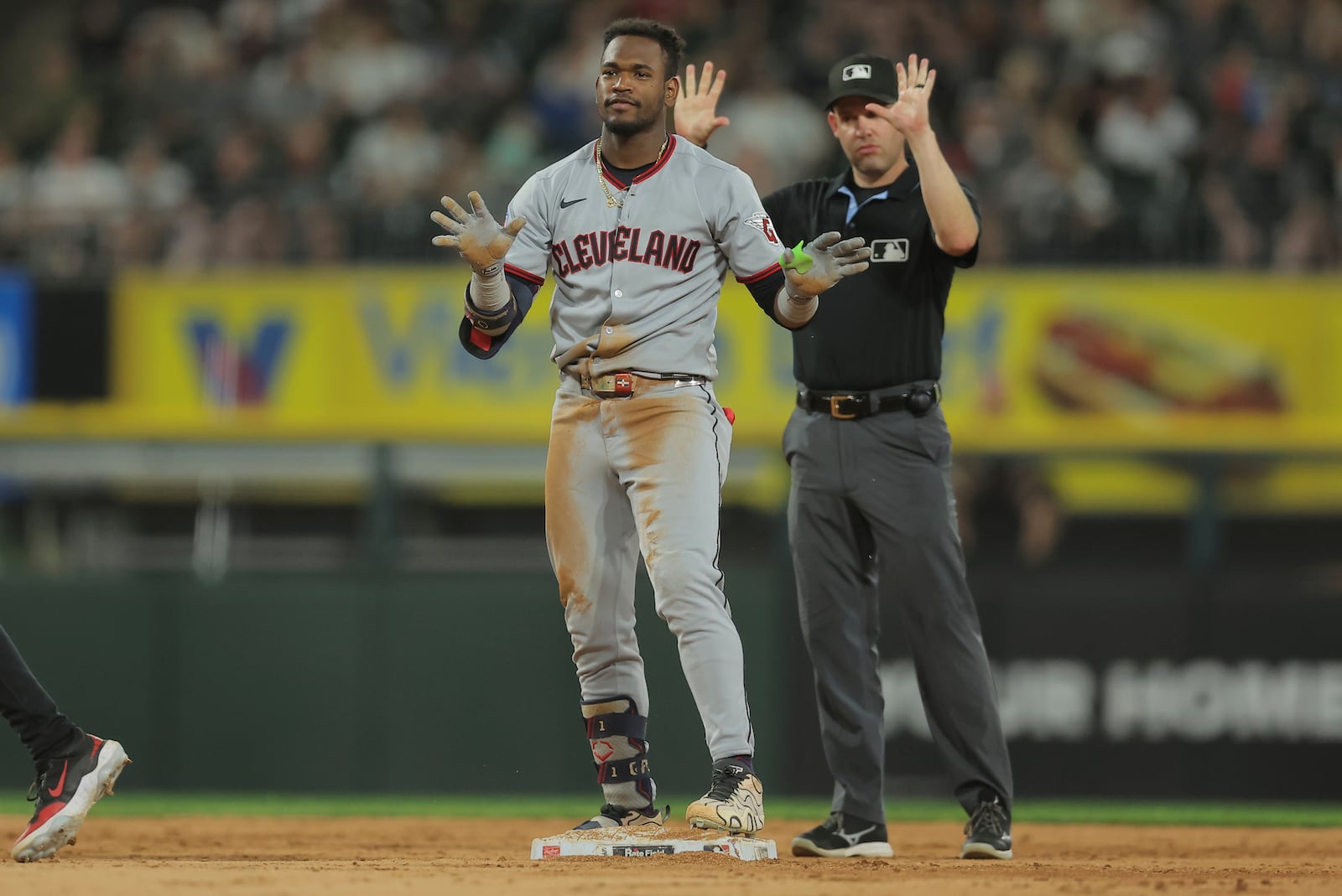 Cleveland Guardians' Angel Martínez, left, celebrates after hitting an RBI double during the seventh inning in the second baseball game of a doubleheader against the Chicago White Sox, Friday, July 11, 2025, in Chicago. (AP Photo/Melissa Tamez)