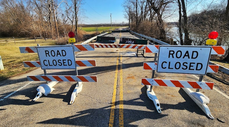 Franklin Trenton Road is closed after a section of bridged crumbled into creek bed below between Hobart Avenue and Water Source Drive in Franklin Township. NICK GRAHAM/STAFF
