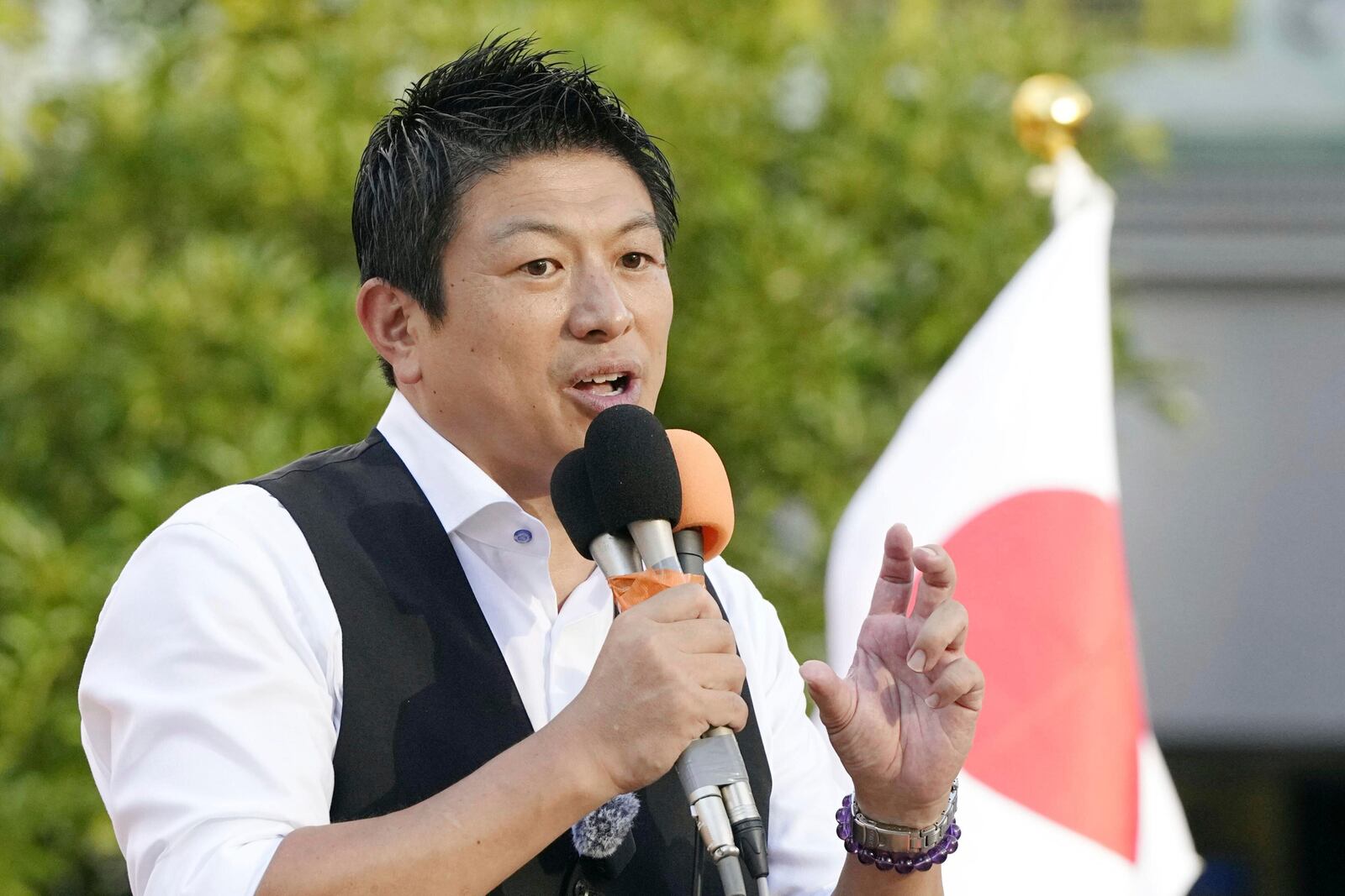 Sohei Kamiya, leader of Japan's far-right populist Sanseito party, speaks during a gathering following the upper house election in Tokyo, Monday, July 21, 2025. (Kyodo News via AP)
