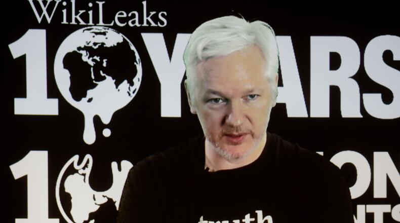 WikiLeaks founder Julian Assange participates via video link at a news conference marking the 10th anniversary of the secrecy-spilling group in Berlin, Germany, Tuesday, Oct. 4, 2016. Assange said that WikiLeaks plans to start a series of publications this week, but wouldn’t specify the timing and subject. (AP Photo/Markus Schreiber)