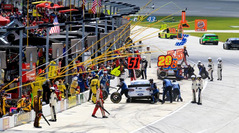 Drivers pit during Sunday’s Quaker State 400 race at Kentucky Speedway Sunday, June 30, 2013. NICK DAGGY / STAFF
