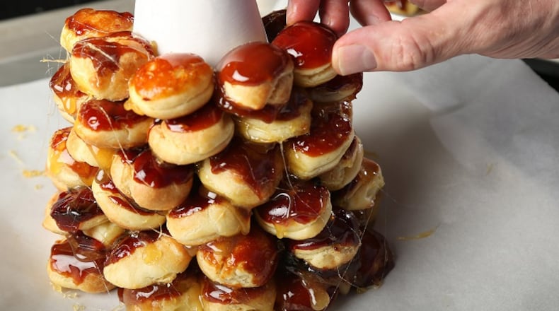While croquembouche as a whole is daunting, when broken down into its individual parts it actually goes easily, though it does take time. (Chris Lee/St. Louis Post-Dispatch/TNS)