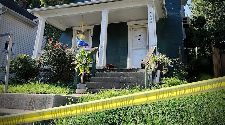 A badly decomposing body found under debris in the detached garage of a Burkhardt Avenue house on Thursday, Aug. 18, 2022, was later identified as 44-year-old CJ Pierce of Dayton, who was reported missing in July. MARSHALL GORBY / STAFF