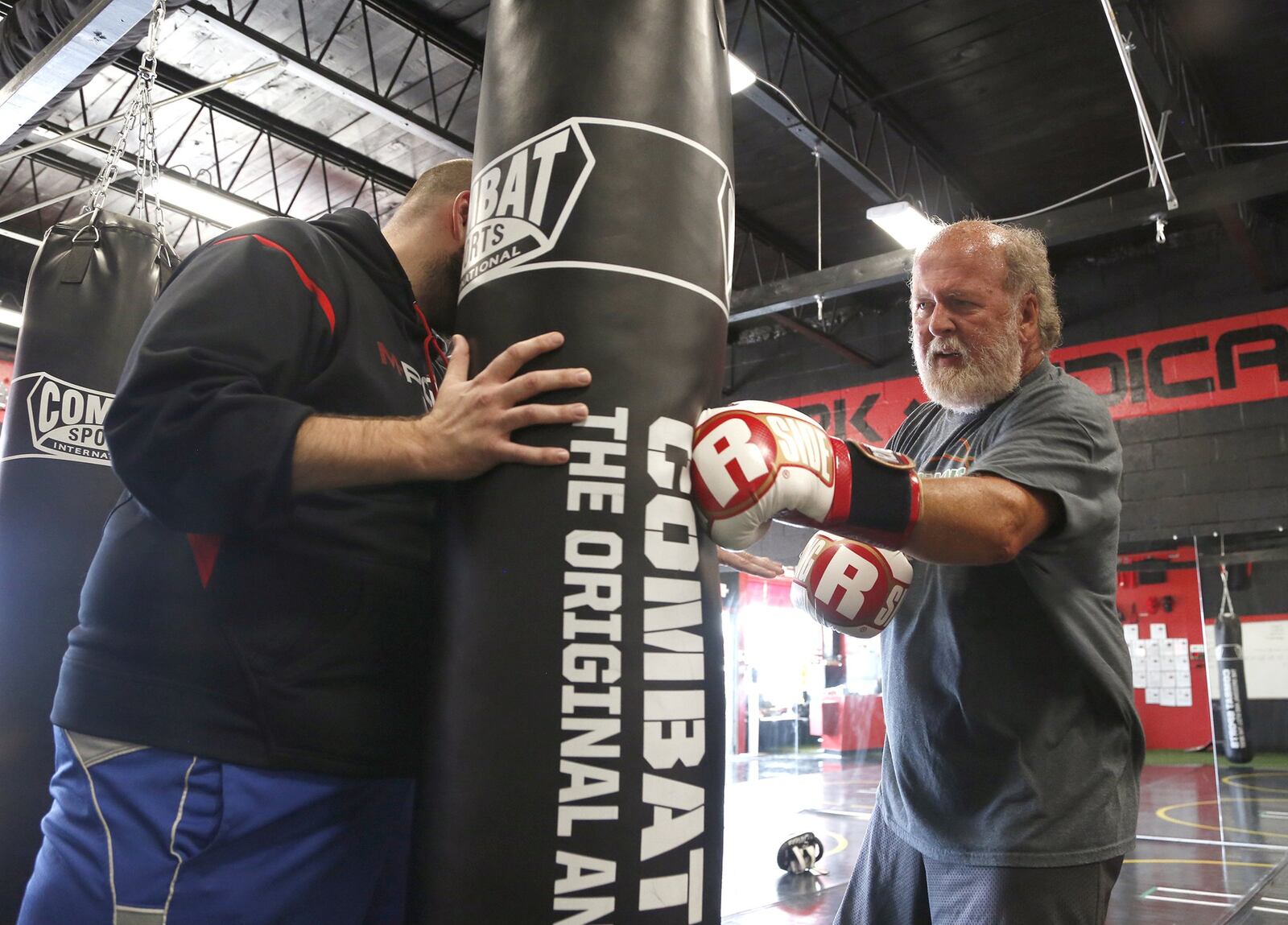 John Stanley of Vandalia works out at M-Power Gym in Vandalia. Stanley, a teacher at Northmont High School, has Parkinson’s disease and says his condition is improving with non-contact boxing workouts. LISA POWELL / STAFF