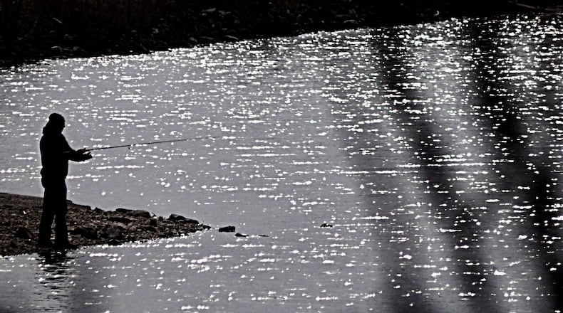 Warmer temperatures called fishing enthusiasts to the shimmering Eastwood Lake waters at Eastwood MetroPark. MARSHALL GORBY / STAFF
