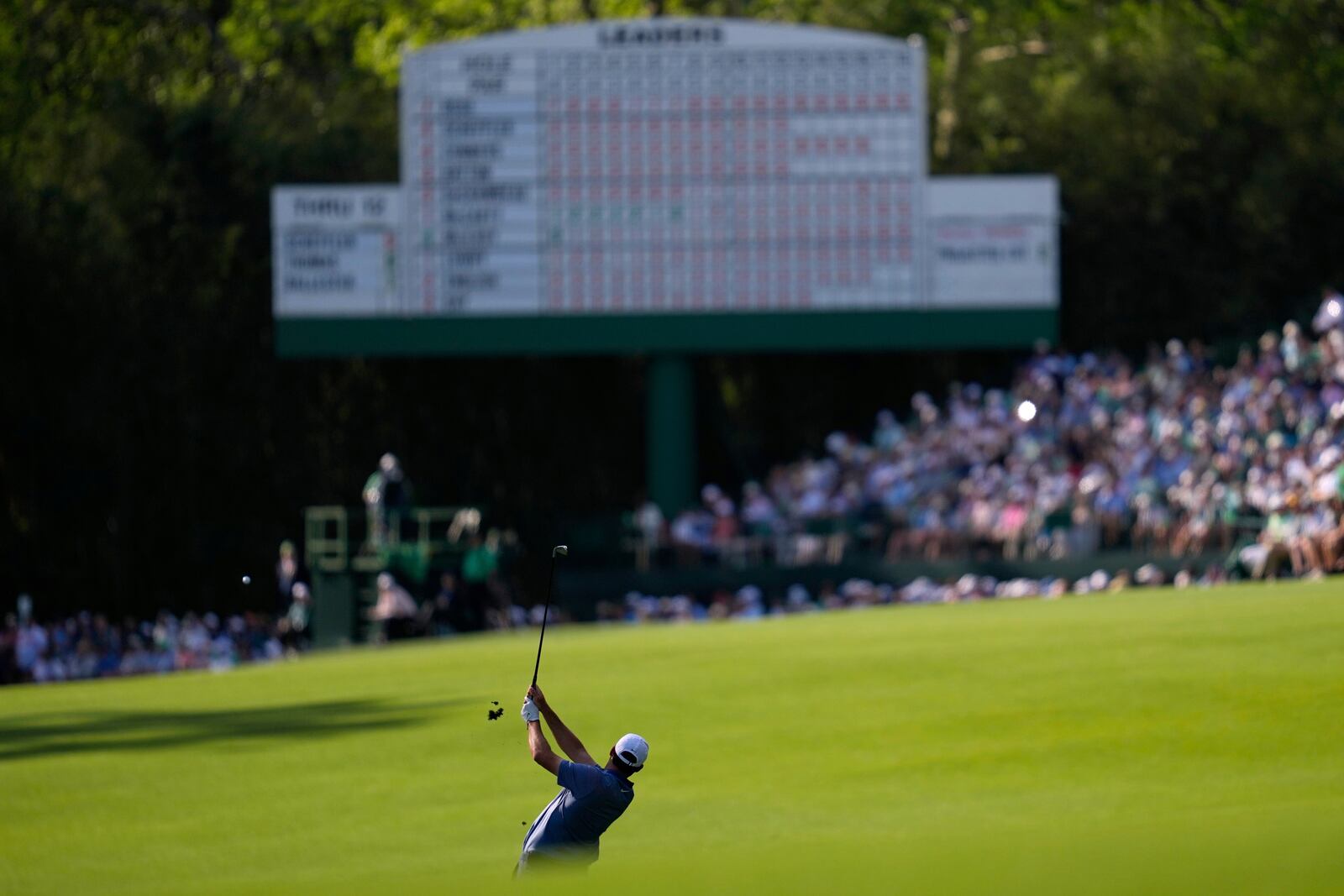 Scottie Scheffler hits from the fairway on the 13th hole during the second round at the Masters golf tournament, Friday, April 11, 2025, in Augusta, Ga. (AP Photo/Ashley Landis)