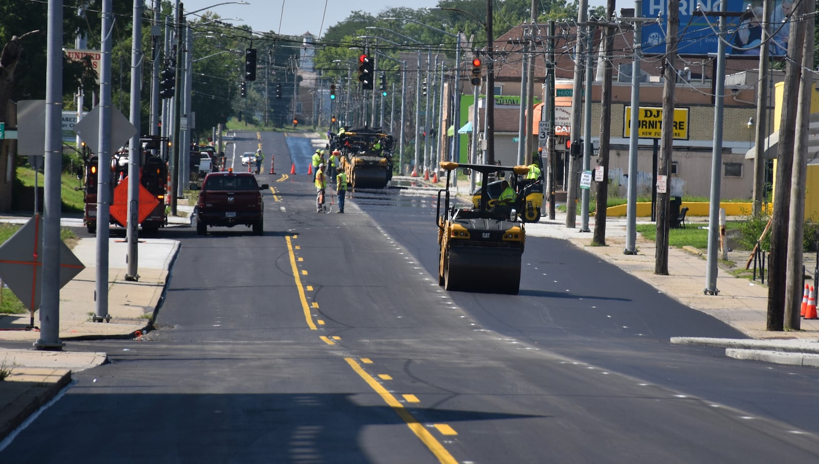 Crews pave North Main Street in Dayton near Hudson Avenue on Tuesday, July 22, 2025. CORNELIUS FROLIK / STAFF