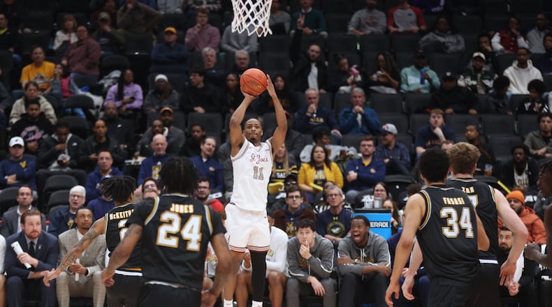 Xzayvier Brown, of Saint Joseph's, shoots against La Salle in the second round of the Atlantic 10 Conference tournament on Thursday, March 13, 2025, at Capital One Arena in Washington, D.C. David Jablonski/Staff