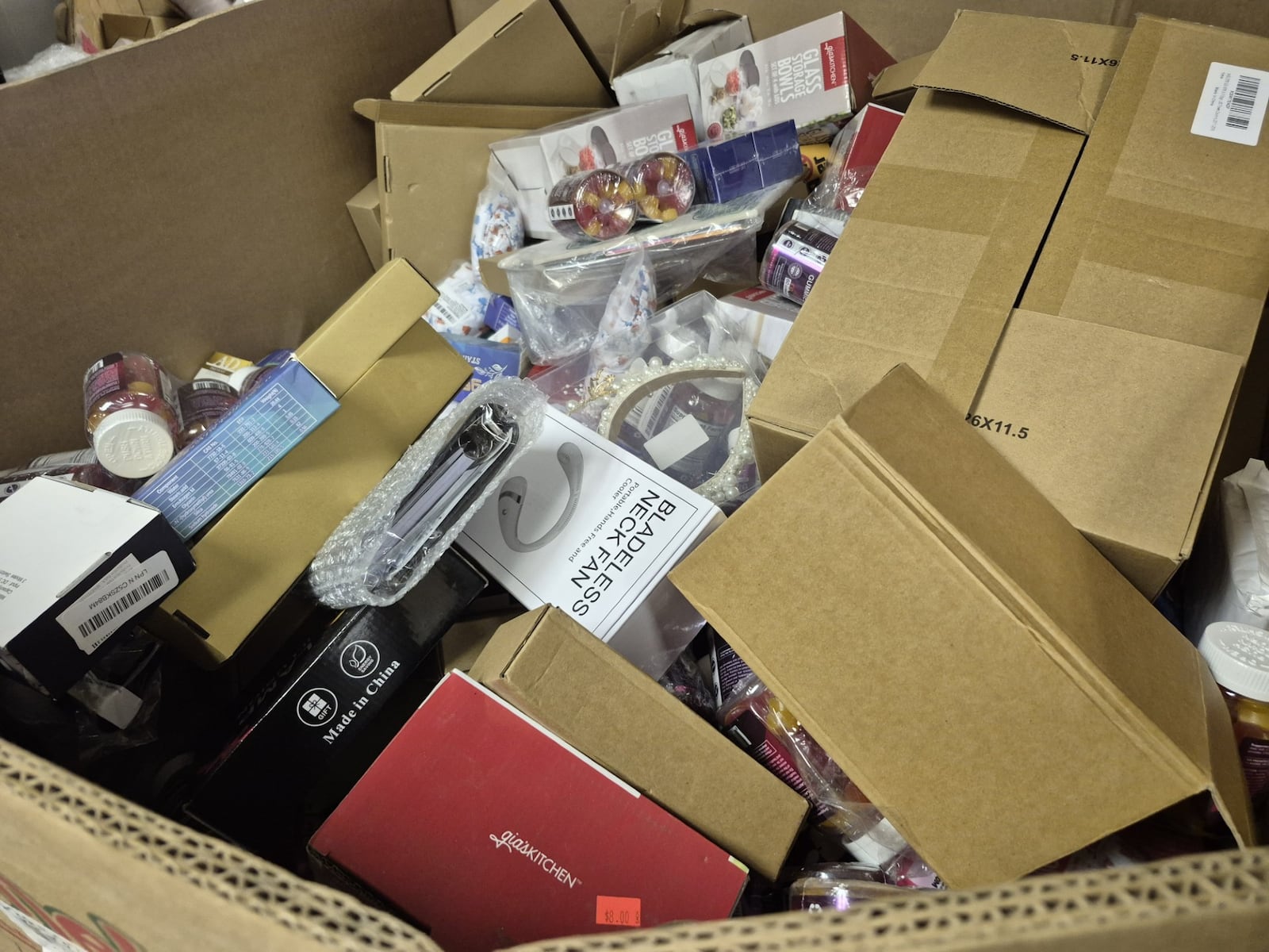 Shoppers never know what they'll find on any given day at a bin store, from food to home goods to clothing. MICHAEL KURTZ / STAFF