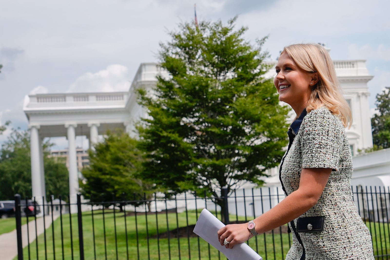 White House press secretary Karoline Leavitt walks to give an interview to Fox News at the White House, Monday, July 21, 2025, in Washington. (AP Photo/Julia Demaree Nikhinson)
