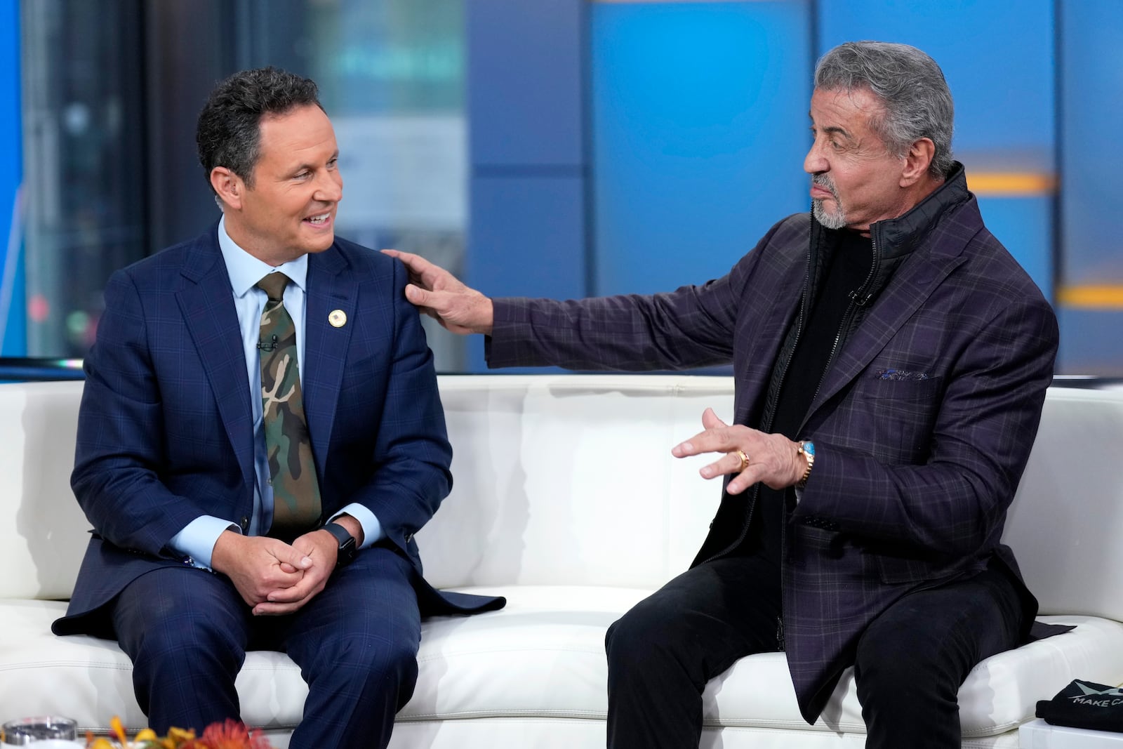 Brian Kilmeade, left, and Sylvester Stallone appear on "Fox & Friends" on Friday, Nov. 11, 2022, in New York. (Photo by Charles Sykes/Invision/AP)