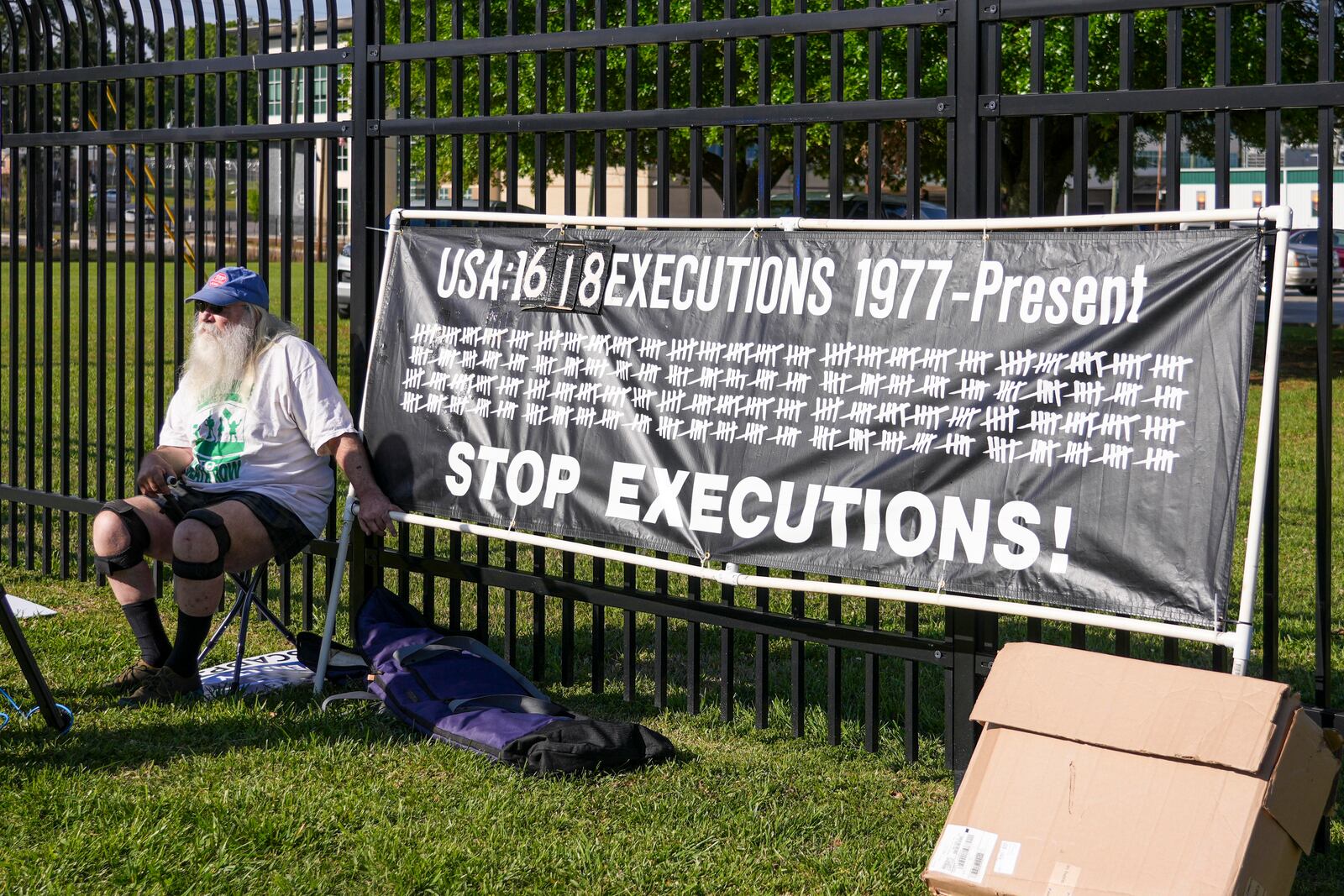 Ron Kaz demonstrates outside the site of the scheduled execution of South Carolina inmate Mikal Mahdi in Columbia, S.C., Friday, April 11, 2025. (AP Photo/David Yeazell)
