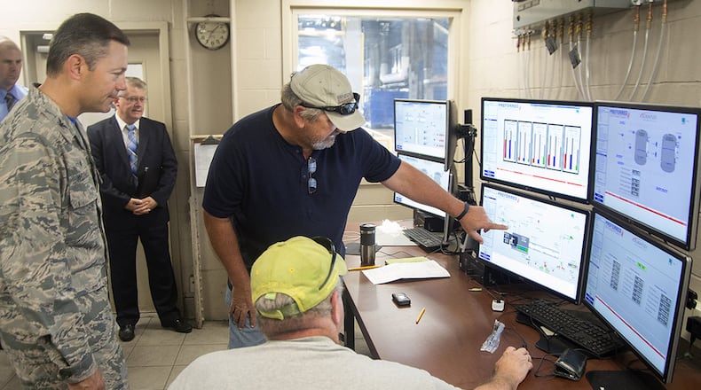 Ken Ferguson, 88th Air Base Wing Civil Engineering Group Area A Boiler Plant supervisor, explains to Col. Bradley W. McDonald, 88th ABW commander, the capabilities of the plant Sept. 22. The plant on Wright-Patterson Air Force Base was recently converted from coal to natural gas, which is cleaner and enables the plant to adjust to base demand quicker. (U.S. Air Force photo/R.J. Oriez)