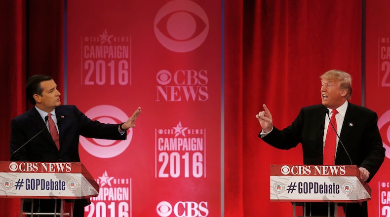 GOP DEBATE--Republican presidential candidate, businessman Donald Trump, right, and Republican presidential candidate, Sen. Ted Cruz, R-Texas, speak at the same time during the CBS News Republican presidential debate at the Peace Center, Saturday, Feb. 13, 2016, in Greenville, S.C. (AP Photo/John Bazemore)