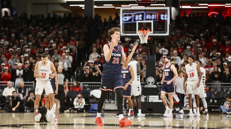 Dayton's Amaël L'Etang protests a call during a game against Cincinnati on Tuesday, Nov. 11, 2025, at Fifth Third Arena in Cincinnati. David Jablonski/Staff